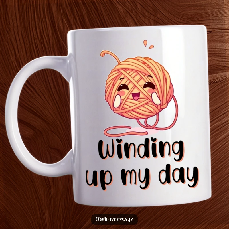 Funny mug featuring a tangled yarn ball character playfully unwinding itself with pure glee, embodying cozy chaos and crafting fun.