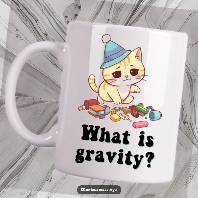 Funny cat mug showing a confused feline wearing a silly hat tripping over scattered items, capturing its clumsy and comical moment.