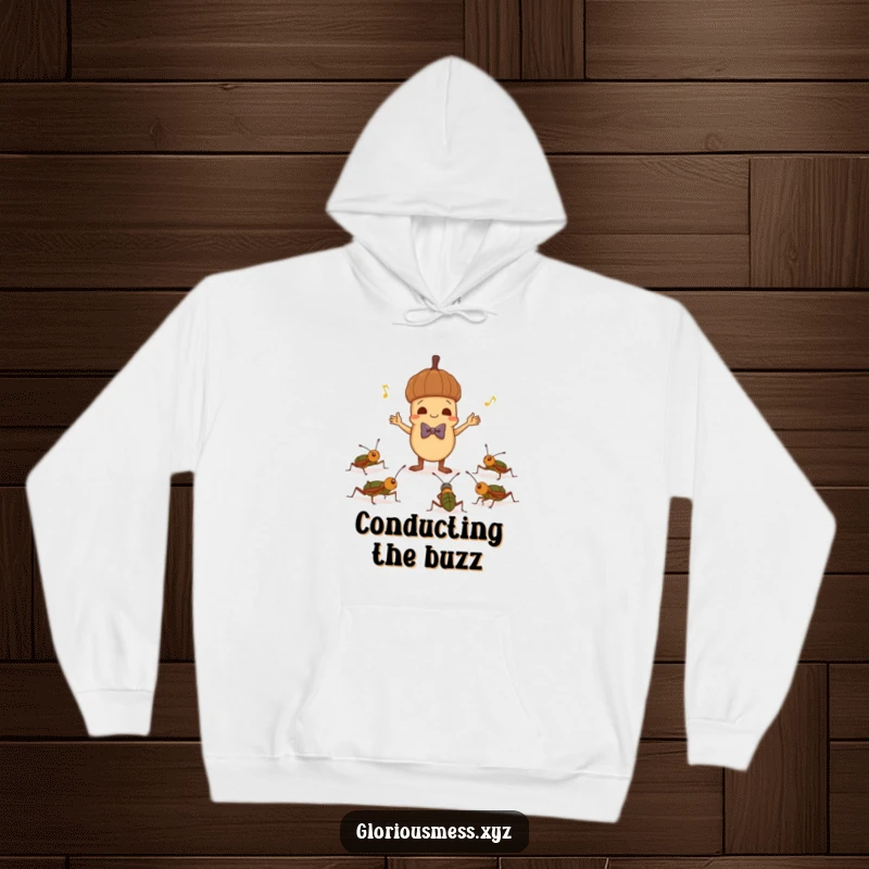 Funny hoodie with a mischievous acorn in a bowtie conducting crickets, offering warmth and a humorous, nature-inspired design.