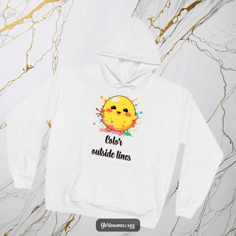 Funny hoodie with a cheerful yellow blob character joyfully splattering a riot of colorful paint, perfect for art enthusiasts and fun lovers.