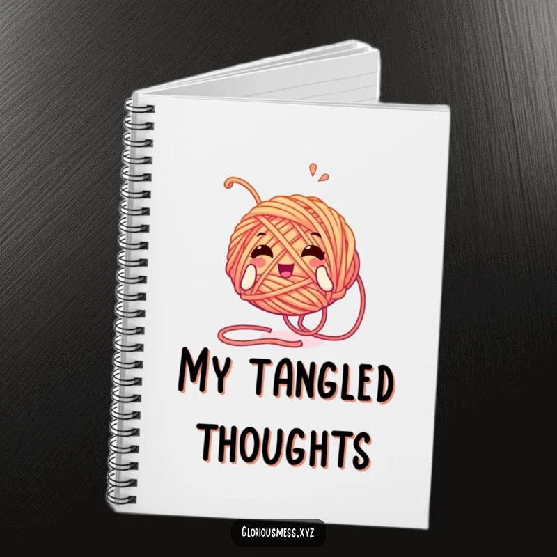 Funny notebook with a tangled yarn ball character unwinding with glee, ideal for jotting down knitting patterns and crafty ideas.