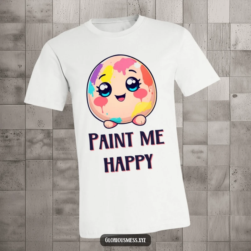Funny t-shirt featuring a cheerful, wide-eyed blob character completely covered in a joyful explosion of colorful paint.