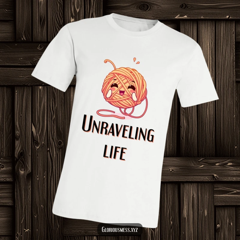 Funny t-shirt showcasing a tangled yarn ball character unwinding itself with glee, celebrating crafting, knitting, and playful messiness.